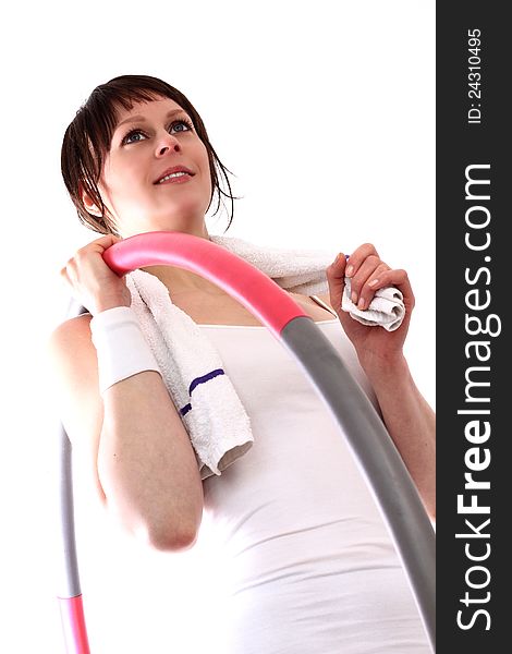 Image of a young woman in the gym after workout with a hula hoop