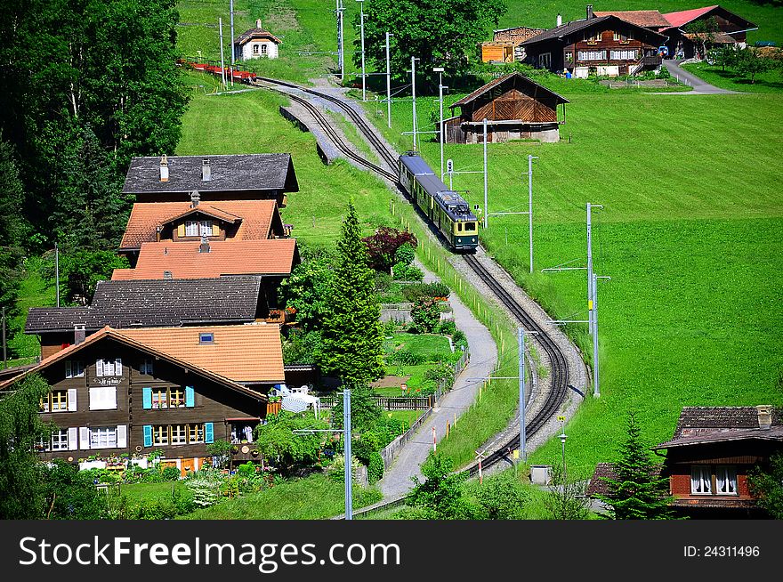 Railway station in swiss Alps. Arrival of the train. Switzerland. Railway station in swiss Alps. Arrival of the train. Switzerland.