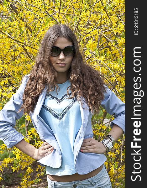 Beautiful young  girl dress up in spring clothes with sunglasses. Beautiful young  girl dress up in spring clothes with sunglasses