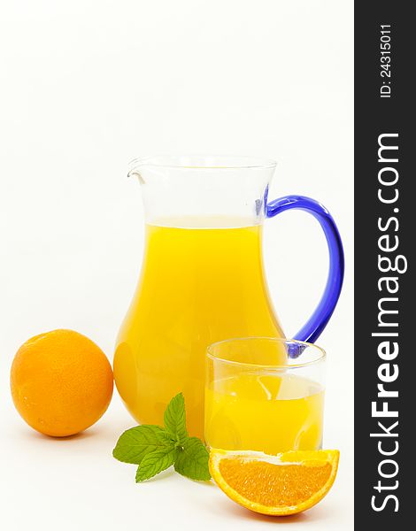Fresh orange juice in a glass jar and to take