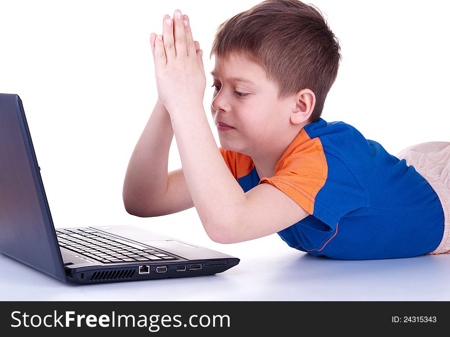 A Child Plays With A Notebook