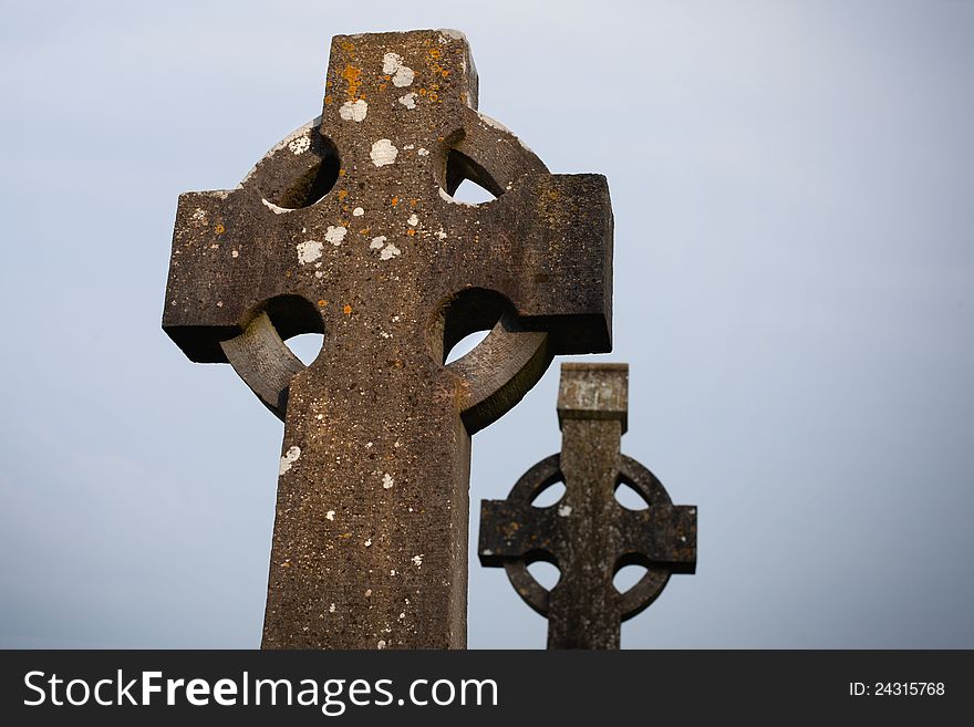 Two Old Celtic Stone crosses in the dusk