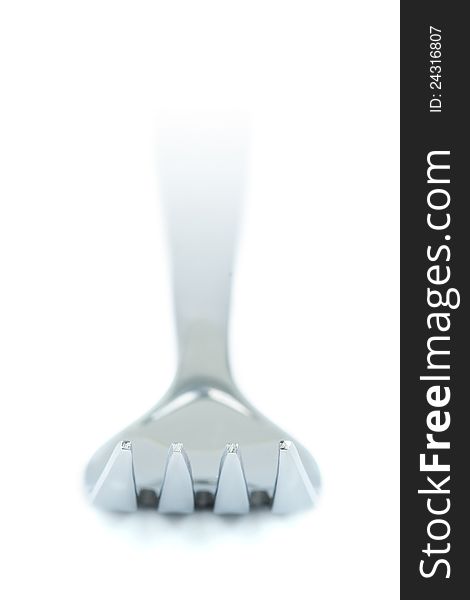Closeup of a fork on a white background