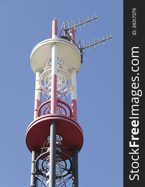 Telecommunications pylon against a blue sky