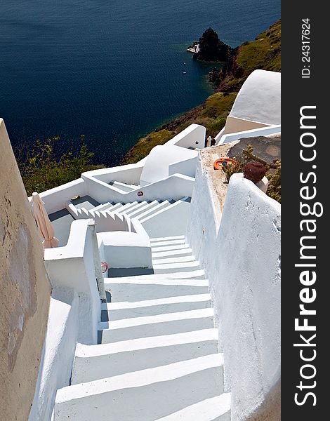 Traditional city of Fira at Santorini island in Greece. Detail image of some steps
going downwards the caldera cliff. Traditional city of Fira at Santorini island in Greece. Detail image of some steps
going downwards the caldera cliff