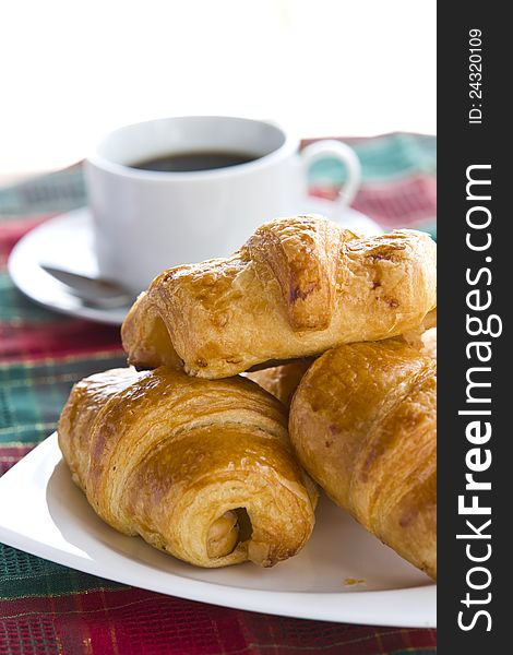 Breakfast with a cup of black coffee and croissants, Shallow DOF. Breakfast with a cup of black coffee and croissants, Shallow DOF