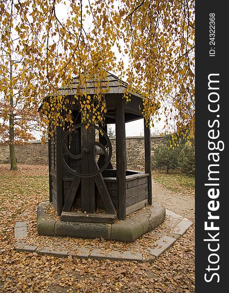 Wooden summerhouse in park with yellow tree leaves. Wooden summerhouse in park with yellow tree leaves