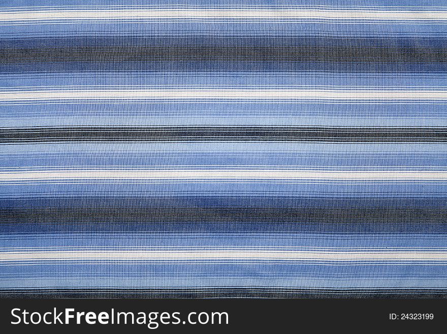 Close-up of a piece of blue and white striped fabric. Close-up of a piece of blue and white striped fabric