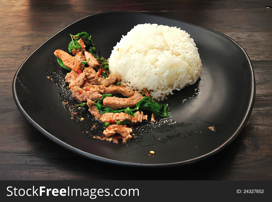 Rice with stir fried hot and spicy pork with basil, Thai food