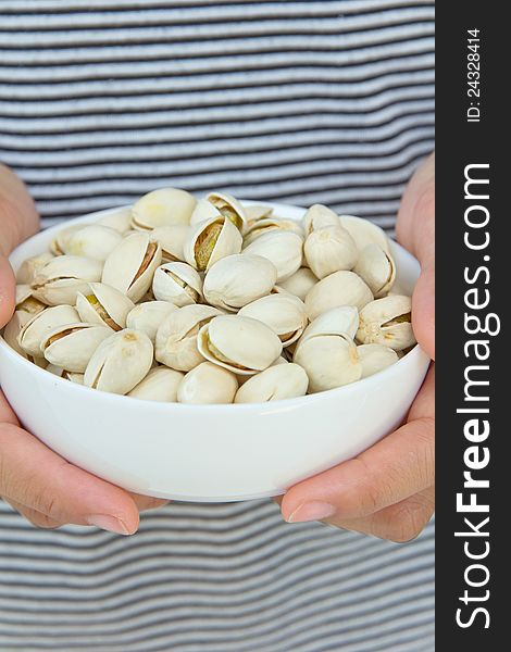 Hand holding pistachios