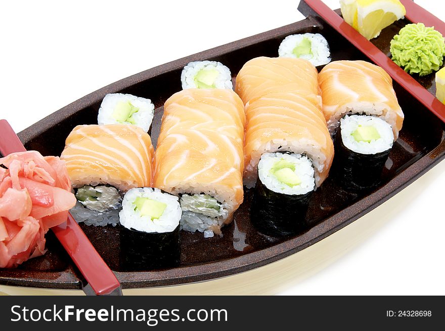 Portion of Japanese sushi with fish and rice on a white background