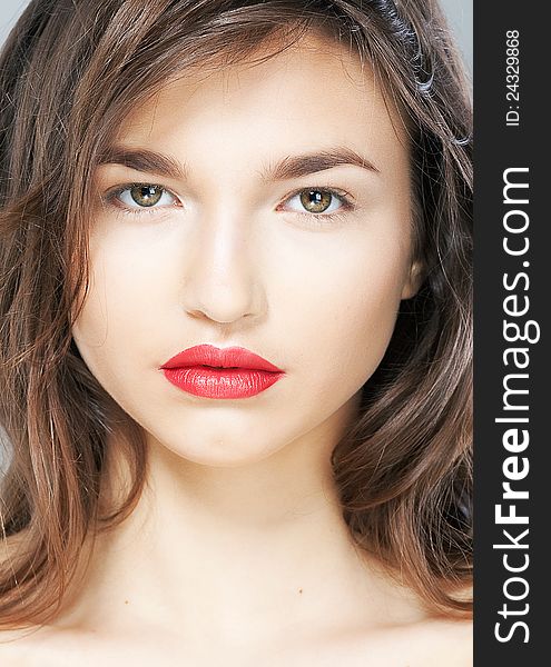 Portrait of beautiful female with sensual red lips closeup. Studio shot. Portrait of beautiful female with sensual red lips closeup. Studio shot