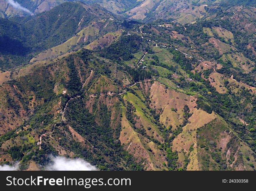 Ribbons of road winding across Costa Rican mountaintops, from the air. Ribbons of road winding across Costa Rican mountaintops, from the air