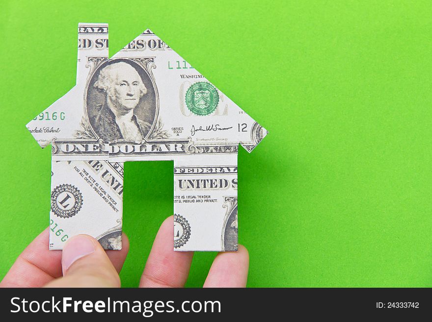 Banknote house icon isolate on green background