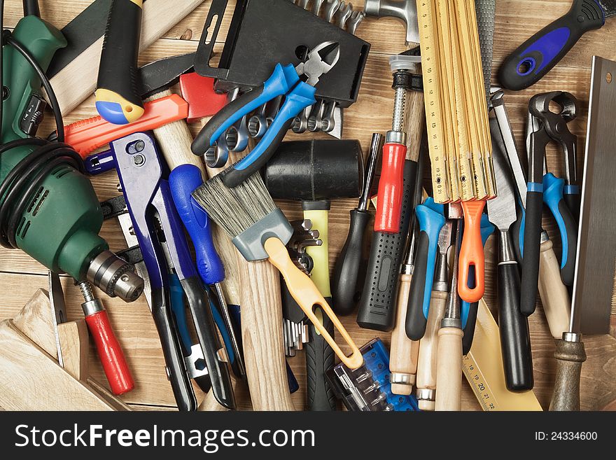 Set of different tools on a wooden planks