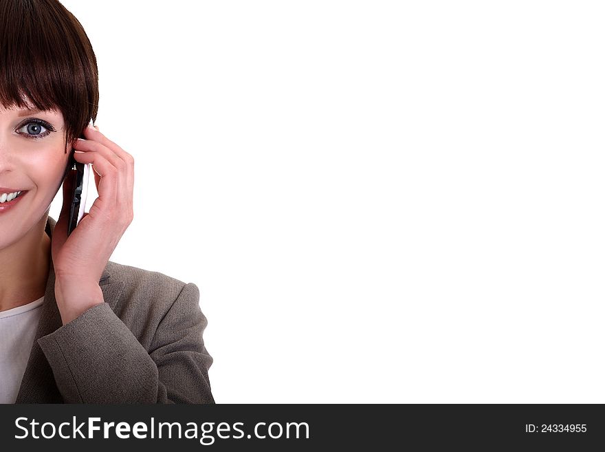 Image of a business lady making a phone call on her mobile phone. Image of a business lady making a phone call on her mobile phone