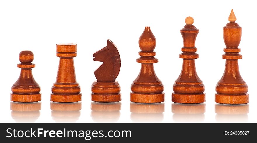 Chess. a group of black wooden chess pieces on a white background