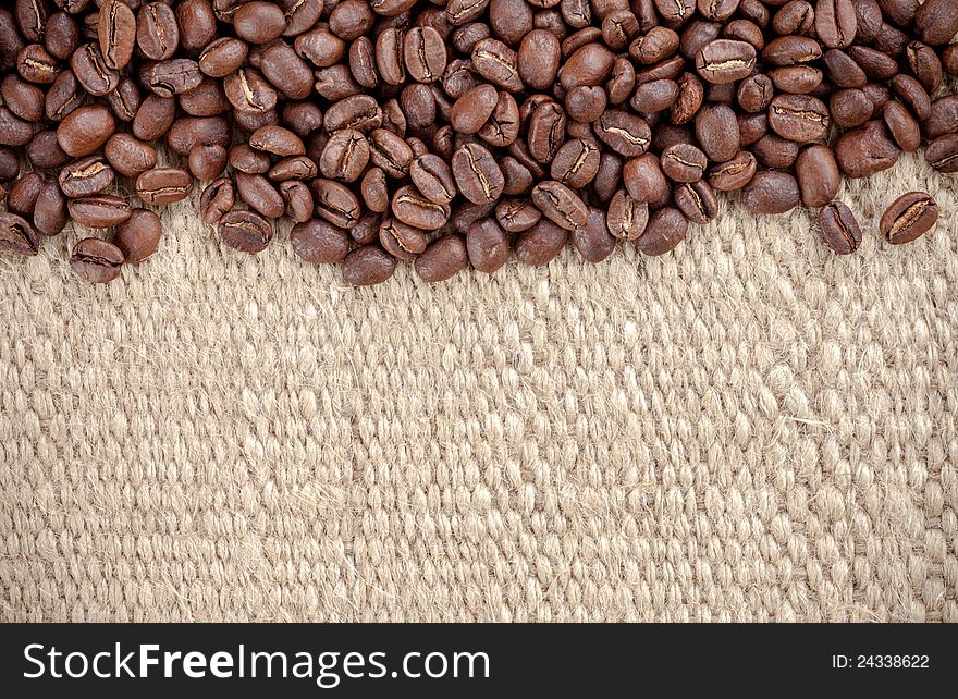 Coffee grain on hemp bag, text space