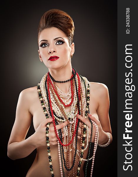 Portrait Of Beautiful Woman With Many Beads