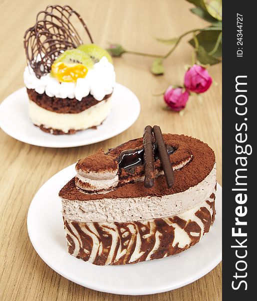 Chocolate Cake and cake with fruits onthe table. Chocolate Cake and cake with fruits onthe table