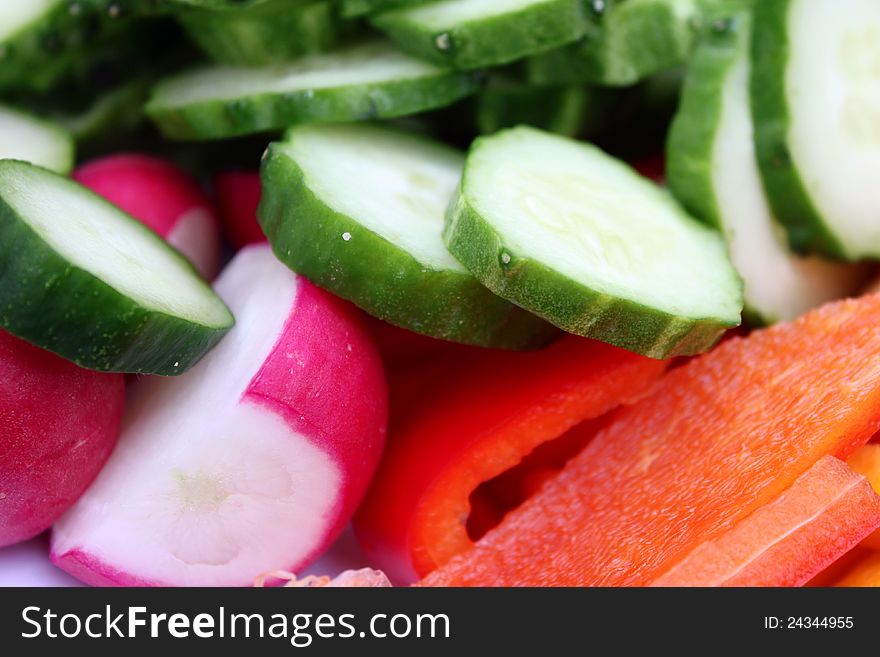 Vegetarian spring salad with cucumber, radish and pepper