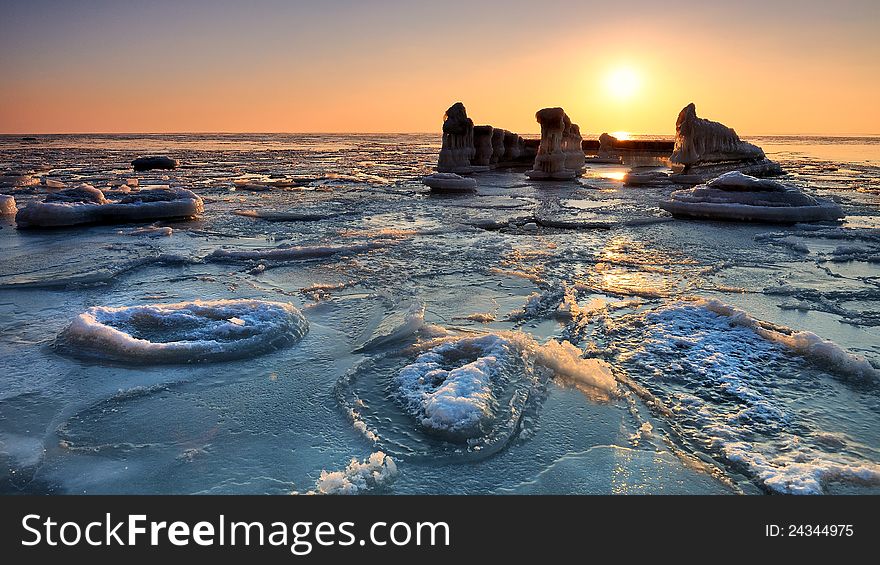 Color full sunset on frozen sea