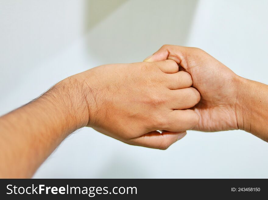 A healthcare worker rubbing the fingers with alcohol-based hand rub.infection control concept. A healthcare worker rubbing the fingers with alcohol-based hand rub.infection control concept.