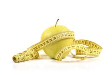 Green Apple With Measure Tape Royalty Free Stock Images