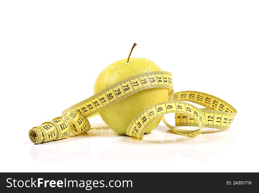 Green apple with measure tape. isolated on white background