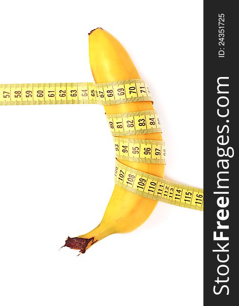 Diet concept. banana with measuring tape