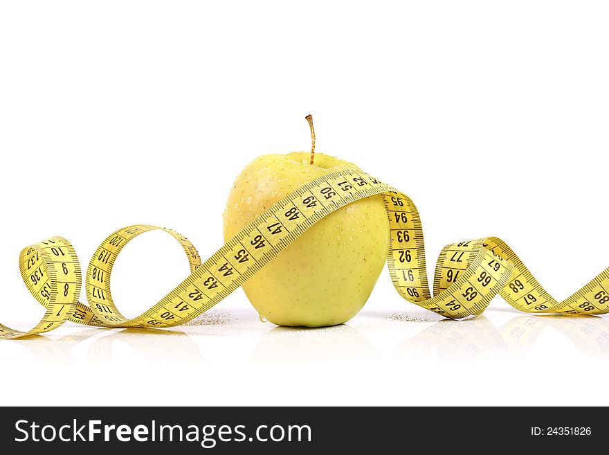 Fresh apple with measuring tape. isolated on white background