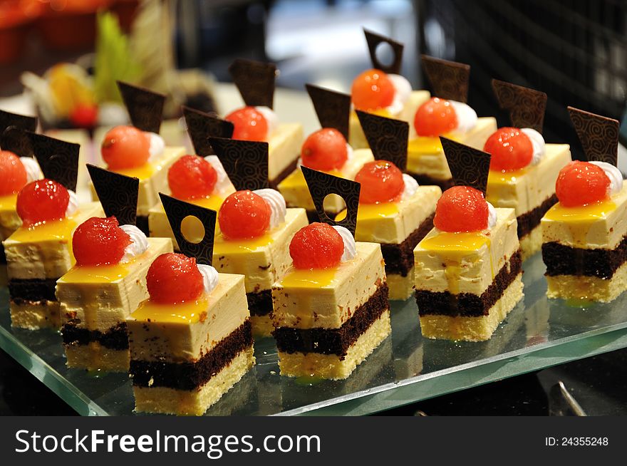 Chocolate and cream cakes with watermelon balls