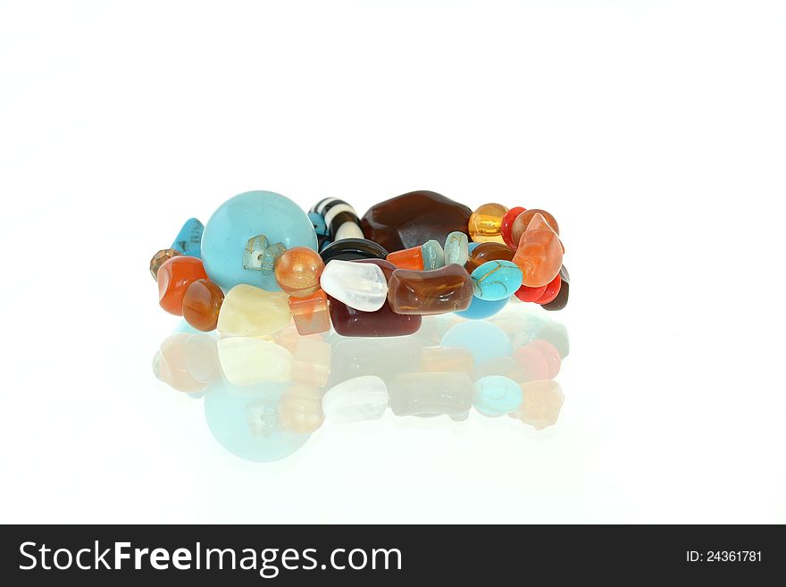 Colored beaded bracelet on white background