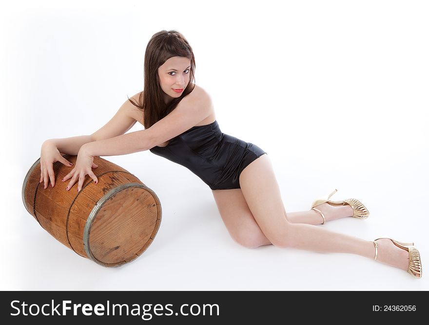 A Vargas-inspired image of a cute woman in a one piece swimsuit and high heels, leaning playfully on a barrel and looking flirtatiously at the viewer. A Vargas-inspired image of a cute woman in a one piece swimsuit and high heels, leaning playfully on a barrel and looking flirtatiously at the viewer