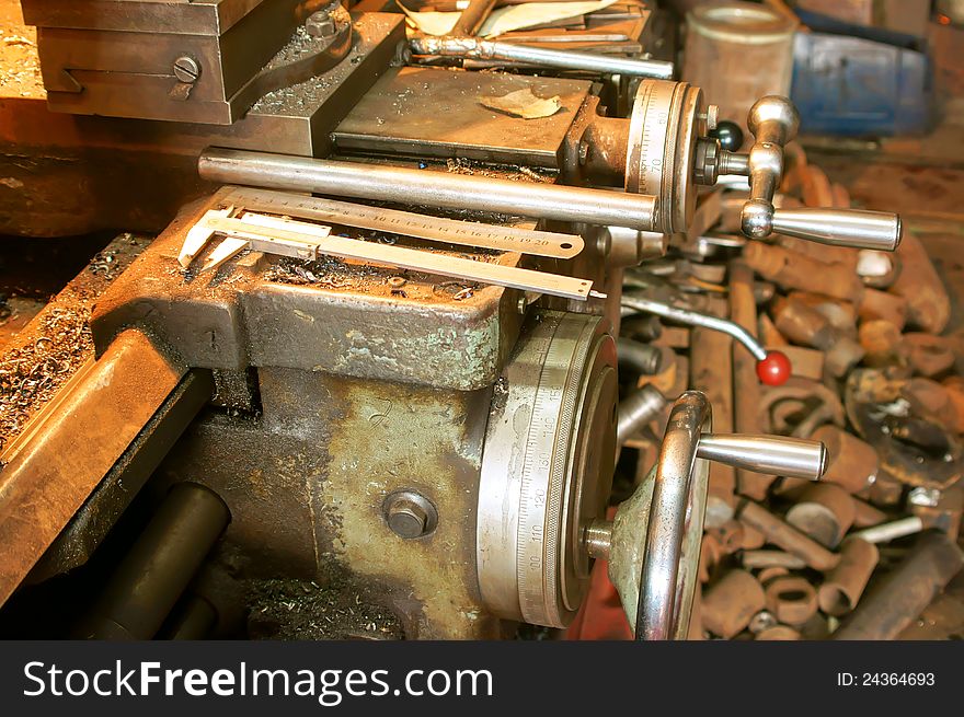 The Old lathe in the manufacture solution, close-up. The Old lathe in the manufacture solution, close-up