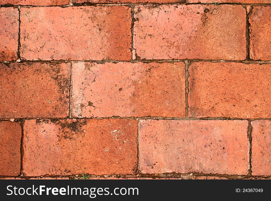 Close up view with texture of terra cotta brick floor