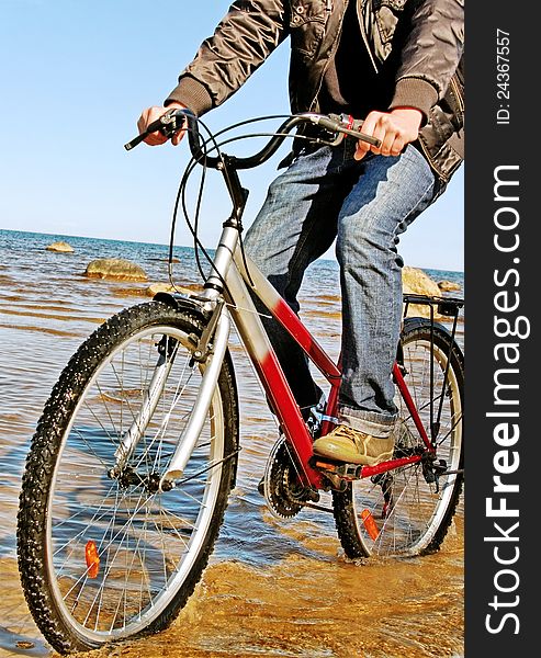 Man with bike at sea. Man with bike at sea.