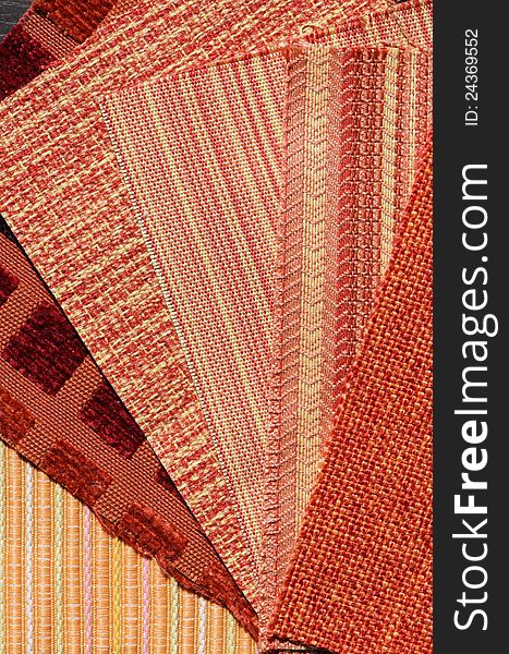 Colour fan or swatches of different sofa upholstery fabrics in various tints of orange; interior design concept. Colour fan or swatches of different sofa upholstery fabrics in various tints of orange; interior design concept