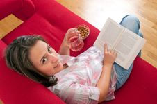 Young Woman Relaxing And Reading A Book Royalty Free Stock Photos Young Woman Relaxing And Reading A Book Royalty Free Stock Photos