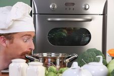Chef Strange Looking At Pot Stock Photo Chef Strange Looking At Pot Stock Photo