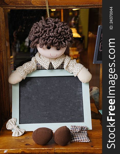 Rag Doll Holding Blackboard