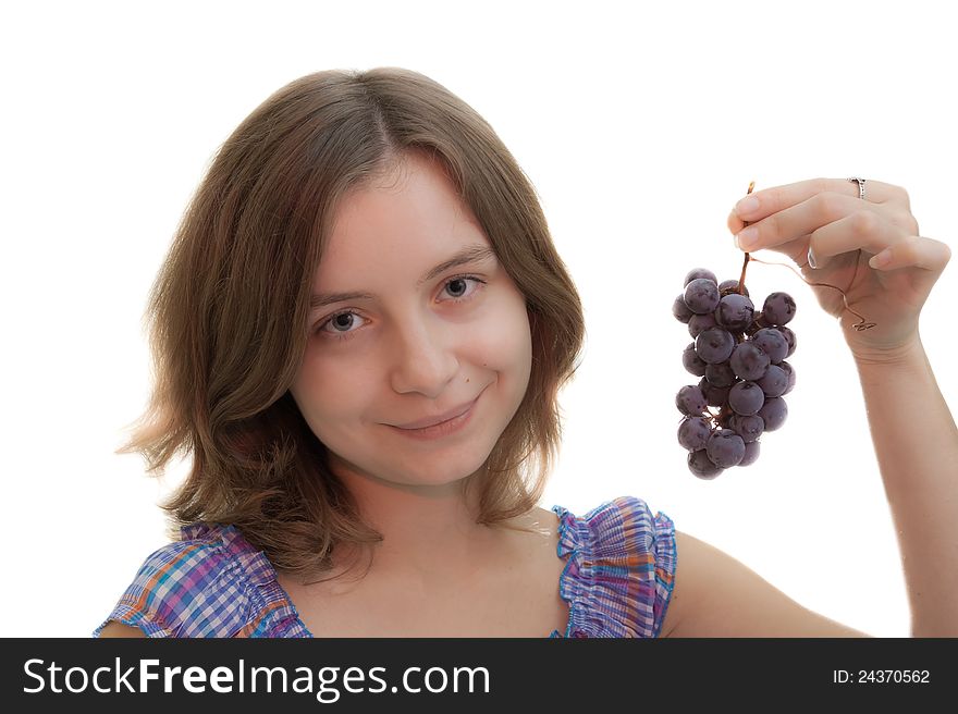 Girl holding a cluster grapes isolated on white. Girl holding a cluster grapes isolated on white