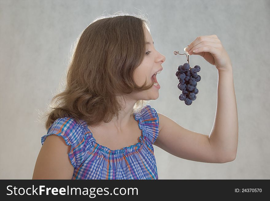 Girl going to eat grapes. Girl going to eat grapes