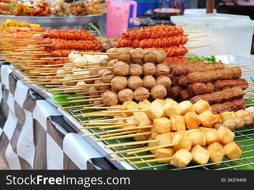 Meatballs on sticks at market