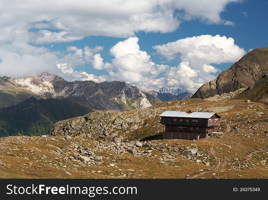 Cottage between Alps and Dolomites under cloudy sky. Cottage between Alps and Dolomites under cloudy sky