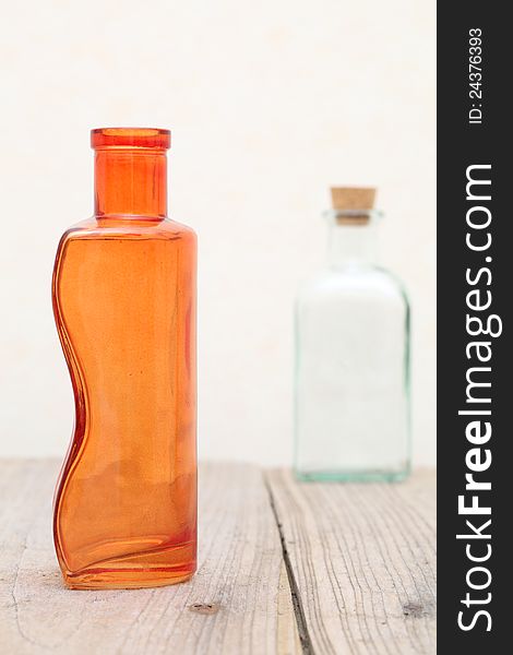 Old glass bottle on wooden table