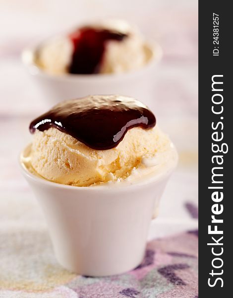 Small vanilla ice cream with chocolate sauce