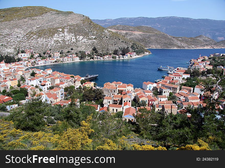 The harbour of the Greek island of Meis. Shows the mainland of Turkey in the background. The harbour of the Greek island of Meis. Shows the mainland of Turkey in the background