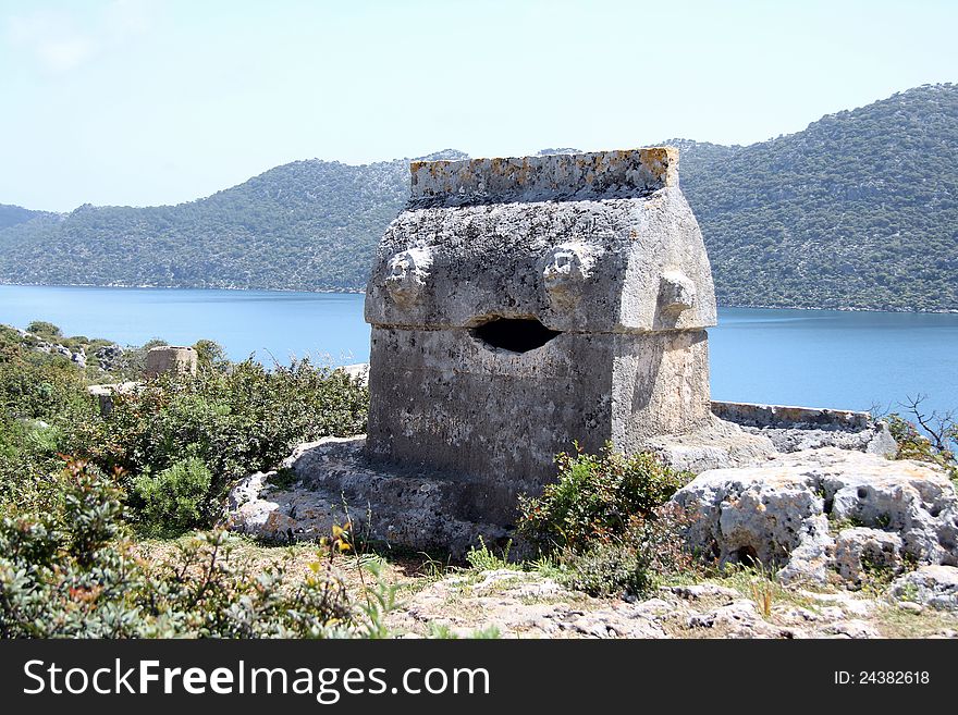 Taken on a walk along the Lycian way to Simena in Turkey. Shows a tomb surroundered by wild flowers. Taken on a walk along the Lycian way to Simena in Turkey. Shows a tomb surroundered by wild flowers