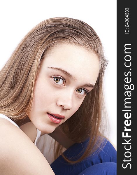 Portrait of young beautiful caucasian woman with blonde hair, studio shoot, over white background